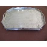 A large silver octagonal galleried twin handle tray with garland and ribbon engraving London 1899/90