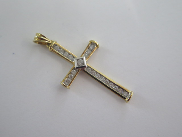 An 18ct yellow gold diamond cross, total diamond weight marked to the back 0.50ct, approx 40mm