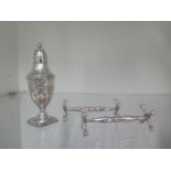 A pair of silver knife rests and a pepper, approx 3.5 troy oz