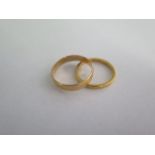 Two 22ct yellow gold band rings, sizes N/Q, total approx 5.8 grams