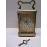 A good quality 8 day French carriage clock striking hours and half hours, dial with pierced brass