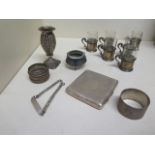 Six small silver holder glass cups 5cm tall, 2 silver napkin rings, a silver cigarette case, an ID