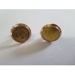 A pair of gold cufflinks marked 14 each inset with an Iran Pahlavi gold coin, total weight approx