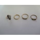 A 9ct yellow gold band ring, size N, a 9ct and silver ring and 2 other 9ct rings, total weight