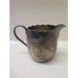 A silver jug - London 1934/35 RWB - Height 9cm - approx weight 7.5 troy oz - small dent to base