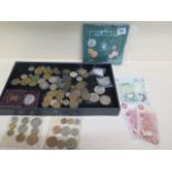 A collection of assorted coins and banknotes