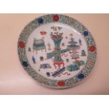 A Famille Verte dish - Diameter 28cm - with old Bonhams label - dish has been broken and repaired