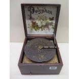 A table top polyphon 6" disc, good working order, 19cm x 19cm missing a tooth