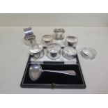 A boxed silver spoon and 9 silver napkin rings, total approx 5.9 troy oz