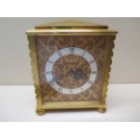 A gilt brass Saint Blaise mantle clock - Height 12cm - working order