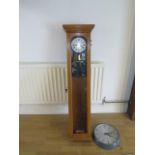 A 20th century oak cased synchronome electric master clock, 130cm, with a Gent slave wall clock 35cm