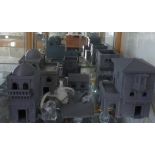 A collection of Wargaming unpainted Corsair buildings