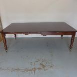 A mahogany pull out dining table with two leaves, 74cm tall x 122cm x 230cm extended closes to