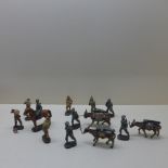 A collection of Italian C Milano WWII composite type toy soldiers, one on horseback, three with pack