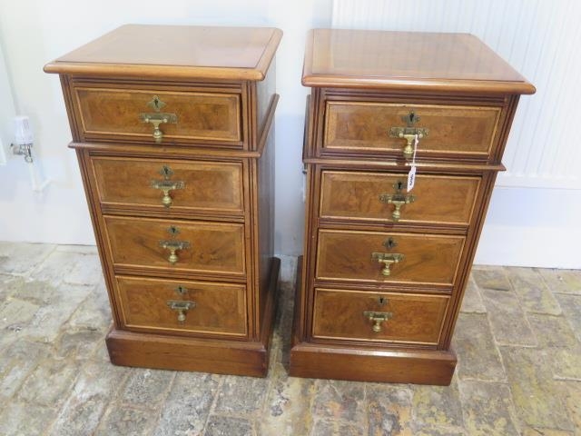 A pair of burr walnut four drawer bedside chests made by a local craftsman to a high standard -