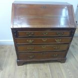 A Georgian mahogany bureau with a well fitted interior over four drawers - Width 84cm x Height 96cm