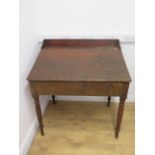 A 19th century clerks desk with lift up sloping top on turned legs, 105cm tall x 99cm x 70cm