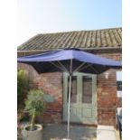 An ex-demonstration blue 2.4m cord pull parasol (base not included)