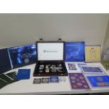 11 coin presentation packs, assorted loose coins and a 1oz fine silver £2 coin