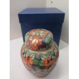 A Moorcroft Flame of the Forest 76916 lidded ginger jar - Height 16cm - in good condition, some