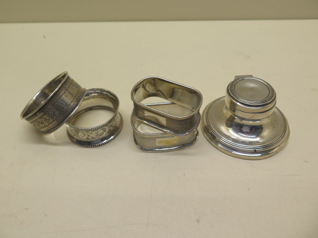 Four silver napkin rings and a small silver inkwell - weighable silver approx 1.5 troy oz - all