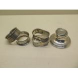 Four silver napkin rings and a small silver inkwell - weighable silver approx 1.5 troy oz - all