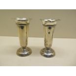 A pair of weighted silver vases - Height 12cm - some overall small dents