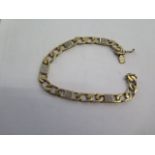 A 9ct yellow gold diamond set bracelet - Length 21cm - approx weight 22.9 grams - all stones intact,