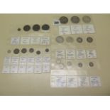 A collection of 24 Victorian coins dating from 1838 to 1901 including three silver crowns in sleeves