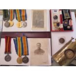An interesting family related group of 7 medals, photographs, Masonic medals to include A Queens