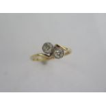 An 18ct yellow gold two stone diamond crossover ring - each diamond approx 0.40ct - diamonds