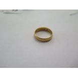 A 22ct yellow gold band ring size U/V - 5mm band - approx weight 6.4 grams