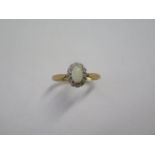 An 18ct yellow gold diamond and opal ring size U - head approx 10mm x 9mm - approx weight 4.3