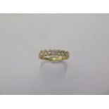 A hallmarked 18ct yellow gold seven stone diamond eternity ring size N/O - approx weight 2.4 grams -