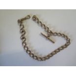 A yellow gold watch chain - Length 37cm - surface tests to approx 9ct - approx weight 52 grams -