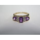 A 9ct yellow gold amethyst and diamond ring, head size approx 18mm x 6mm, good colour amethyst, size