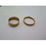 Two hallmarked 22ct yellow gold rings sizes Q and W - 3 and 6mm band - total weight approx 11.3