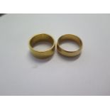 Two yellow gold band rings sizes R and S - 9mm and 7mm band - both test to approx 18ct - old test