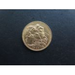 A Victorian gold full sovereign coin dated 1900