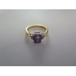 A hallmarked 18ct yellow gold amethyst and diamond ring size N - approx weight 3.6 grams - in good