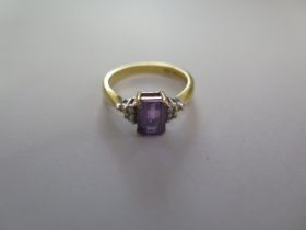 A hallmarked 18ct yellow gold amethyst and diamond ring size N - approx weight 3.6 grams - in good