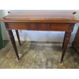 A mahogany Regency style serving table with a cutlery drawer - in polished condition - Height 87cm x