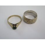 A 9ct white gold band ring size M/N and a 9ct green stone ring (stone worn) ring size O/P - total