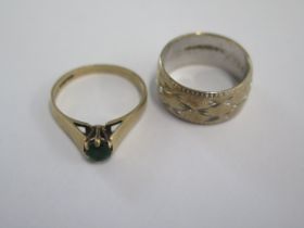 A 9ct white gold band ring size M/N and a 9ct green stone ring (stone worn) ring size O/P - total