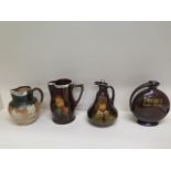 Two Doulton Dewars jugs, a Kingsware silver rim jug and a silver rim Harvest ware jug - Height