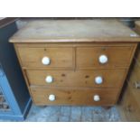 A Victorian stripped pine four drawer chest - Height 82cm x 86cm x 46cm