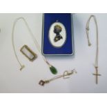 A 14ct gold pendant on 14ct chain, a 14ct crucifix on a plated chain, a 9ct pendant on chain and a