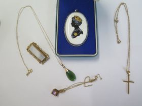 A 14ct gold pendant on 14ct chain, a 14ct crucifix on a plated chain, a 9ct pendant on chain and a