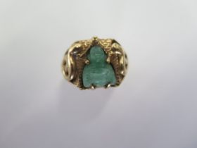 An Oriental yellow gold Jade Buddha ring size R - approx weight 9.5 grams - generally good,