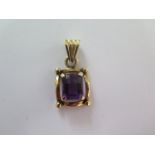 A 14ct yellow gold amethyst pendant - Length 2.5cm - good condition - approx weight 4.5 grams